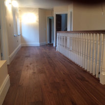 The staircase with walnut and a matt lacquer finish.